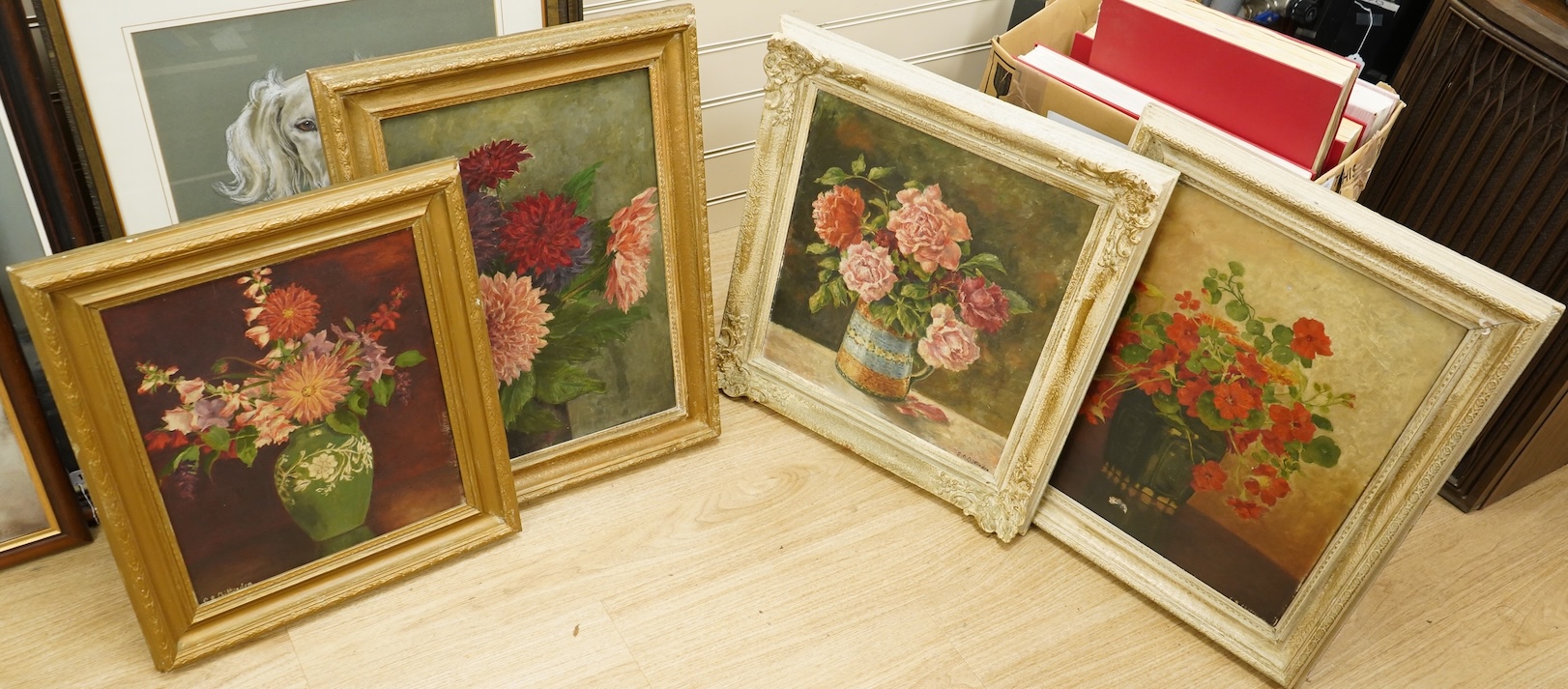 20th century, four still life’s of flowers, each indistinctly signed, oils on canvas, 39 x 34cm